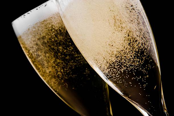 istock two flutes with champagne gold bubbles 537453248