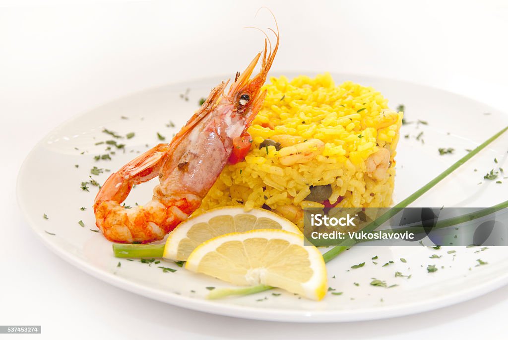 Risotto with shrimps Rissotto with shrimps served with lemon and gourmet. Cooked Stock Photo