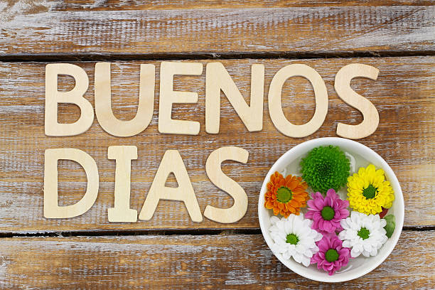 istock Buenos Dias (Good morning in Spanish) in wooden letters, flowers 537453585