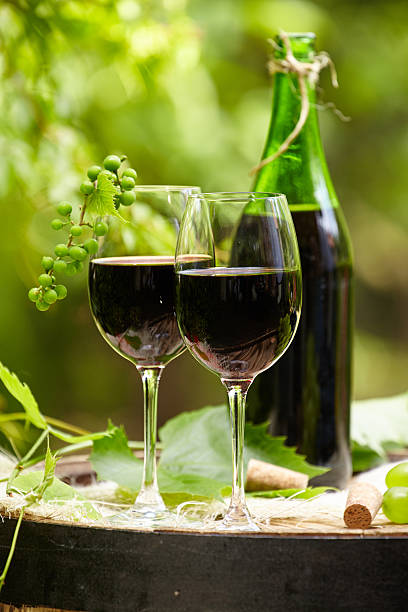 istock red wine bottle and glass on wodden barrel 537453876