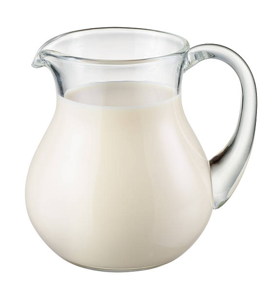 Glass jug of fresh milk isolated. With clipping path