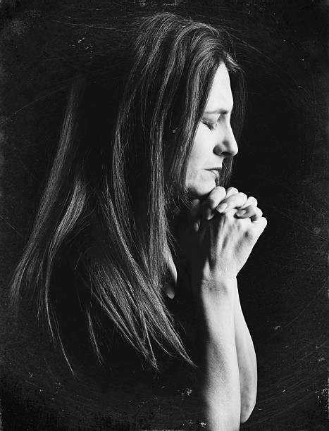 istock Woman In Prayer in Black and White 537454757