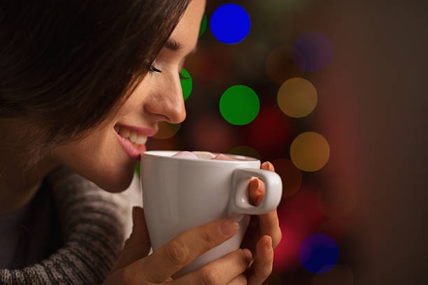 istock Happy young woman enjoying cup of hot beverage 537455096