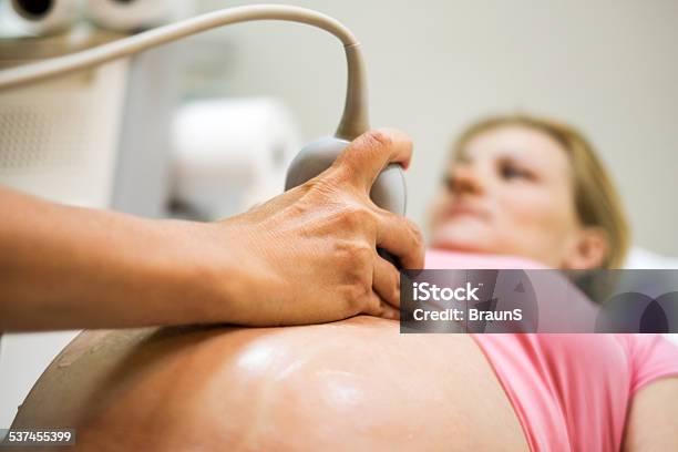 Woman On Ultrasound Exam Stock Photo - Download Image Now - 2015, Abdomen, Adult