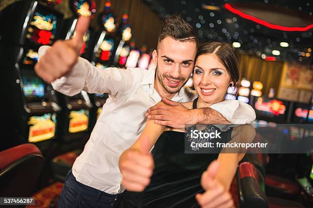Happiness Couple Winning At Casino Stock Photo - Download Image Now - 20-29 Years, 2015, Addiction