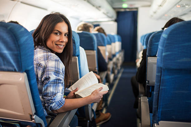 istock Happy woman traveling by airplane. 537456529