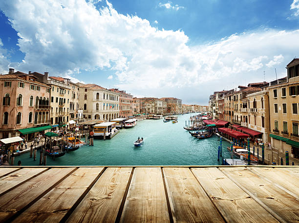 istock Venice, Italy and wooden surface 537456759