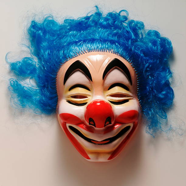istock Creepy Clown Mask With Blue Hair 537457763