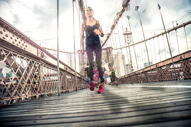 istock Woman running on the Brooklyn Bridge 537458289
