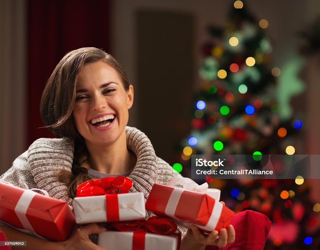 happy young woman holding christmas present boxes Happy young woman holding Christmas present boxes Adult Stock Photo