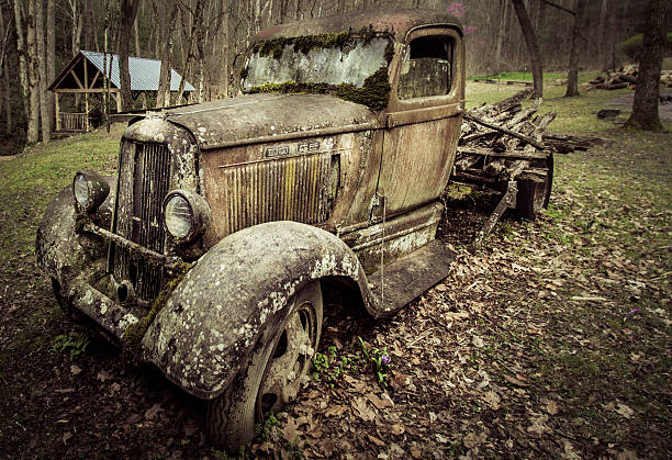 Vintage Dodge Pick Up Truck Gatlinburg, Tennessee, USA - March 25, 2016: Profile of an abandoned 1930's Dodge pick up truck on display at historic Ely's Mill on the outskirts of Gatlinburg. distressed rusty vintage pickup truck close up detail stock pictures, royalty-free photos & images