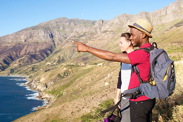 istock Mixed race couple on holiday by the seaside 537461236