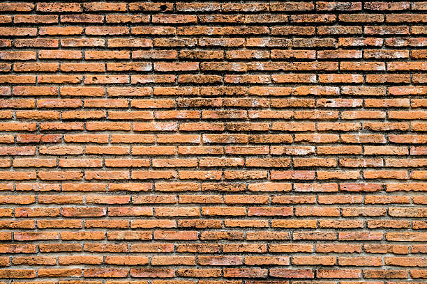 parede de tijolo - orange wall imagens e fotografias de stock