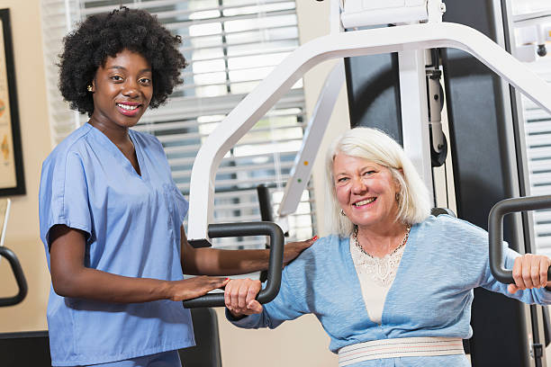 istock Physical therapist working with a female patient 537462180