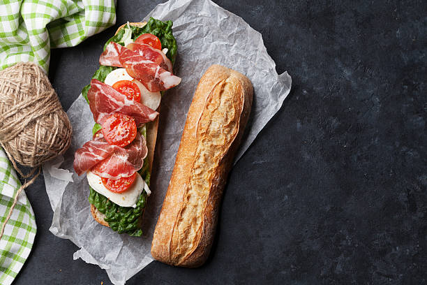 istock Ciabatta sandwich with salad, prosciutto and mozzarella 537463556