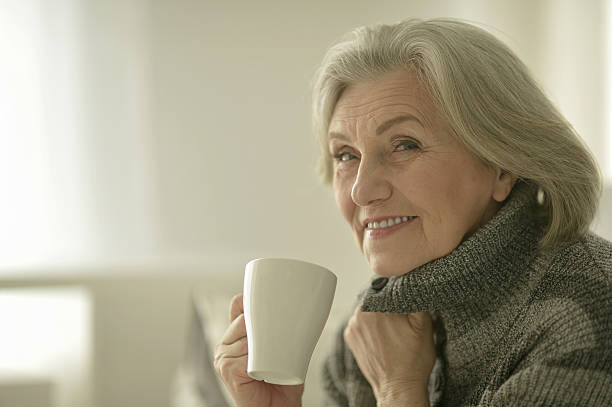istock Senior woman with cup 537464014