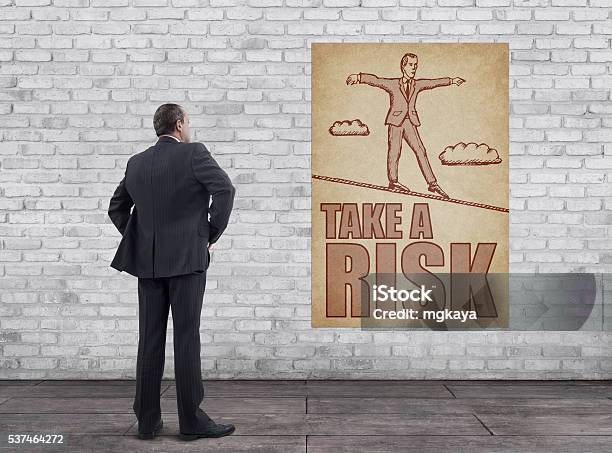 Businessman And Vintage Style Take A Risk Poster Stock Photo - Download Image Now - Tightrope Walking, Tightrope, Acrobat
