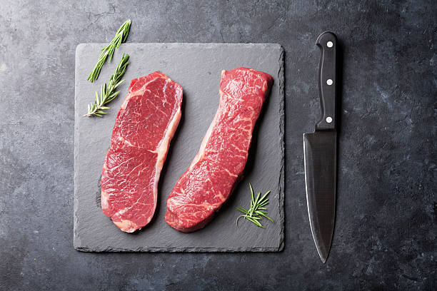 istock Raw striploin steak with rosemary 537464428