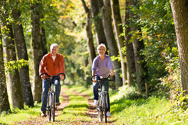 istock Seniors exercising with bicycle 537465828