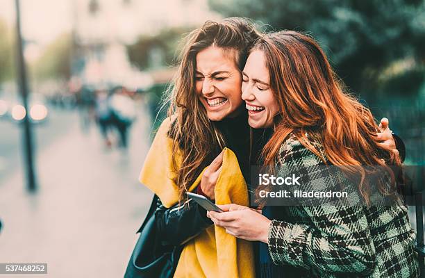 Texting In Paris Stock Photo - Download Image Now - Friendship, Laughing, Female Friendship