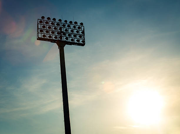 istock Silhouette stadium light and sky at sunset with vintage tone 537468376