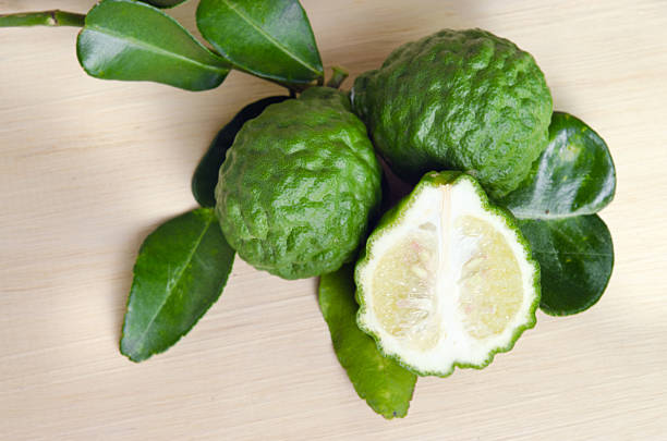 istock Bergamots fruit with leaf on wooden board 537469022