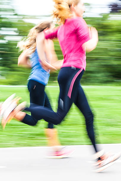 istock Young woman running 537469144