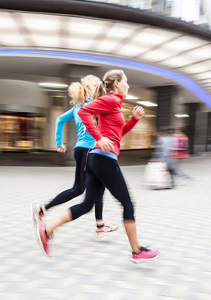 istock Young woman running 537469400