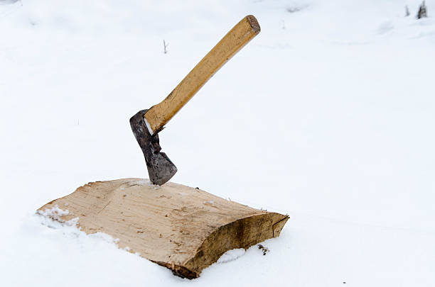 istock chopping wood in the snow 537469439