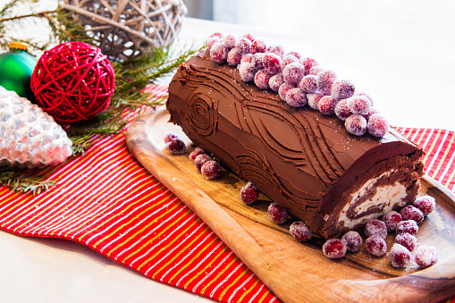 Beautiful display of Christmas yule log cake with Christma decoration