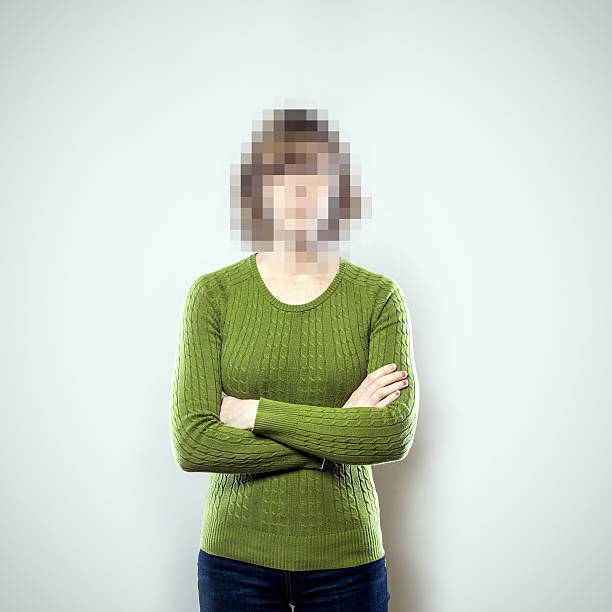 Pixel People Series A portrait of a woman from the waist up, whose face has been rendered unrecognizable by being pixelated.  A conceptual representation of individual identity protection or harassment.  Square crop with copy space on a a clean off-white background. pixelated photos stock pictures, royalty-free photos & images