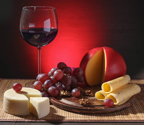 raffinata still life di vino, formaggio e uva - luxury milk dinner glass foto e immagini stock