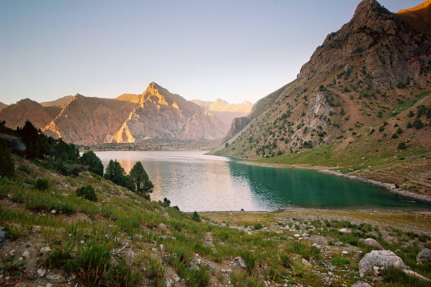 istock blue mountain lake at sunset 537470369