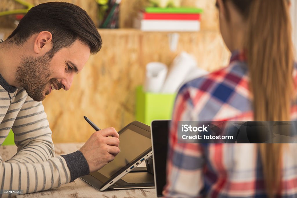 Young man and woman working at modern office Animator Stock Photo
