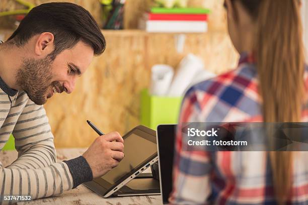 Young Man And Woman Working At Modern Office Stock Photo - Download Image Now - Animator, Females, Graphic Designer