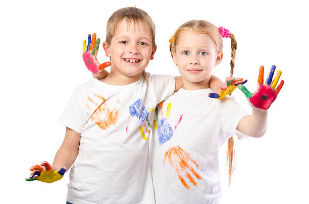 istock Funny boy and girl with painted hands 537471866
