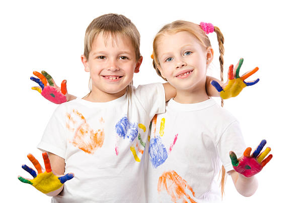 istock Funny boy and girl with painted hands 537471872