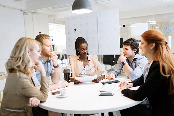 istock Group of business people sitting at desk 537472178