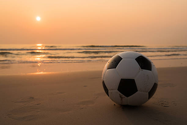 istock Football on the beach 537472866
