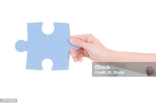 Part Of Puzzle In Woman Hand Isolated On White Stock Photo - Download Image Now - 2015, Adult, Blue