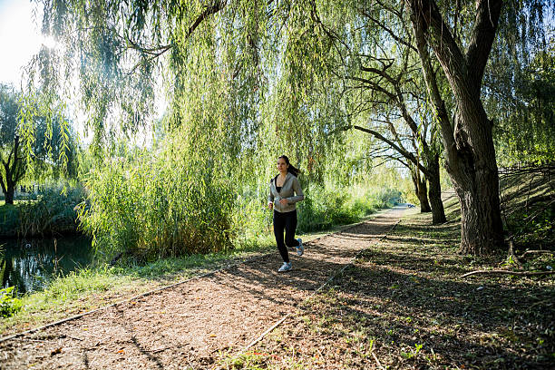 istock Fit beautiful woman jogging in park 537473702