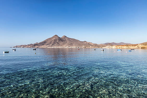 istock View on transparent water with fishboats 537474352