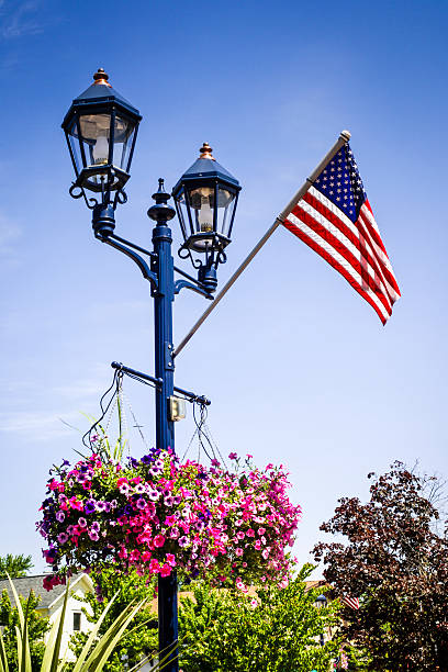 istock Hanging baskets and Flag on a street Lamp post 537475924