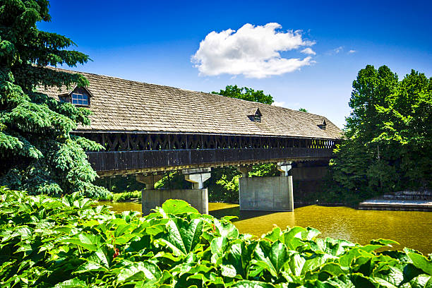 istock Wooden covered bridge over the River Cass in Frankenmuth, MI 537476962