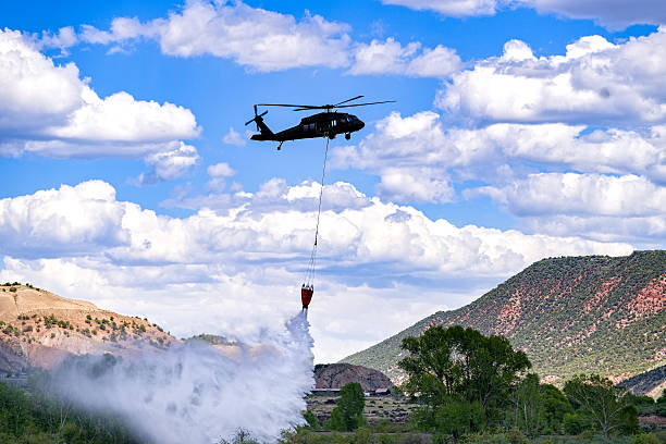 istock Firefighting Helicopter with Water Bucket 537477670