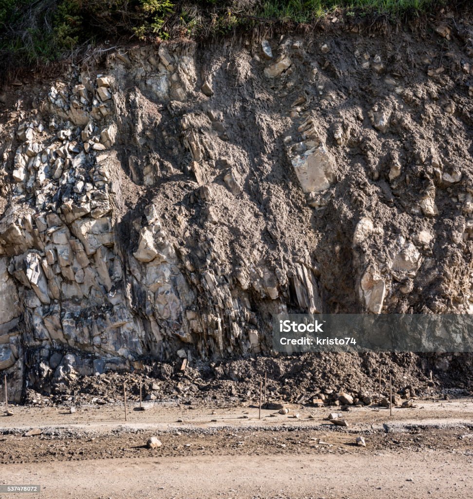 Road under construction. Mountains road under construction. Construction of a retaining wall. Below Stock Photo