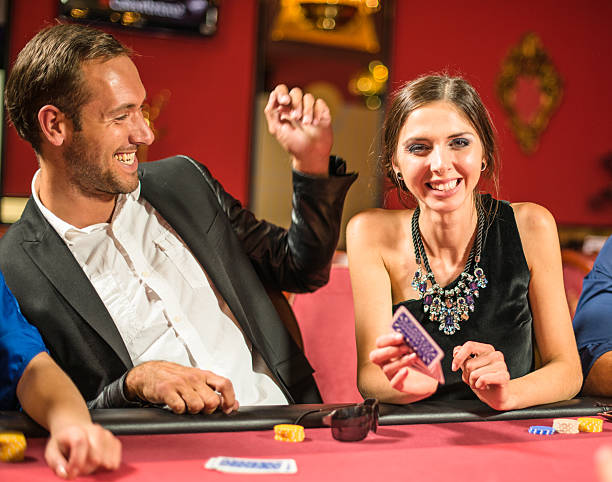 istock Friends playing at poker at Casino 537485947