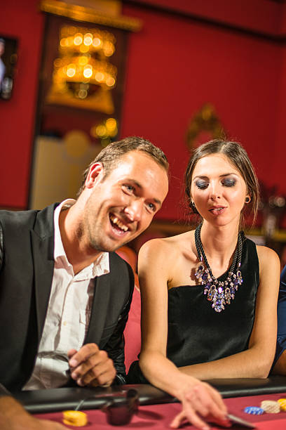 istock Friends playing at poker at Casino 537485953