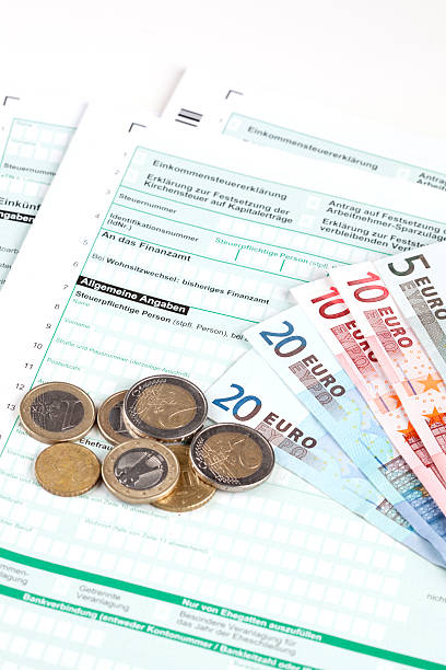 istock German Tax Form with Euro banknotes and coins 537486301