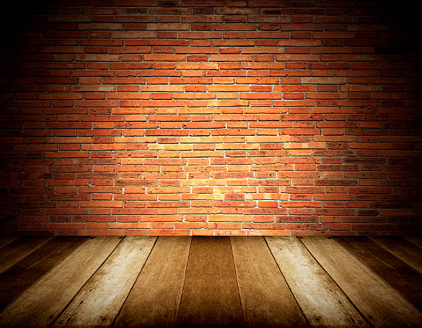 istock wooden floor and brick wall background 537487067